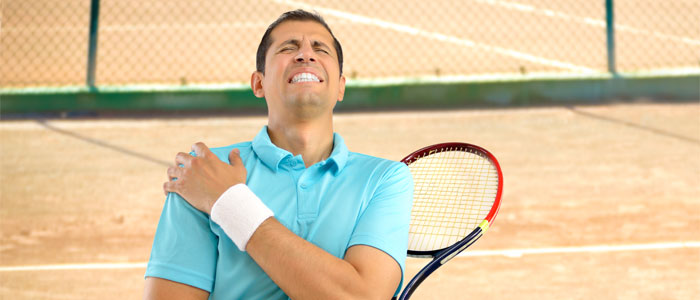 a man with a shoulder injury from playing tennis